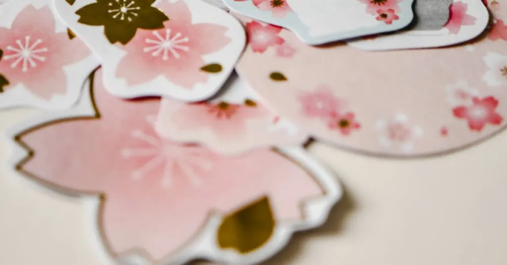 A collection of adorable rabbit and sakura flower stickers arranged on a soft beige surface, perfect for spring decoration.